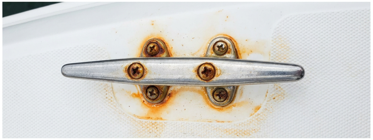 Rusted boat cleat hardware before treatment